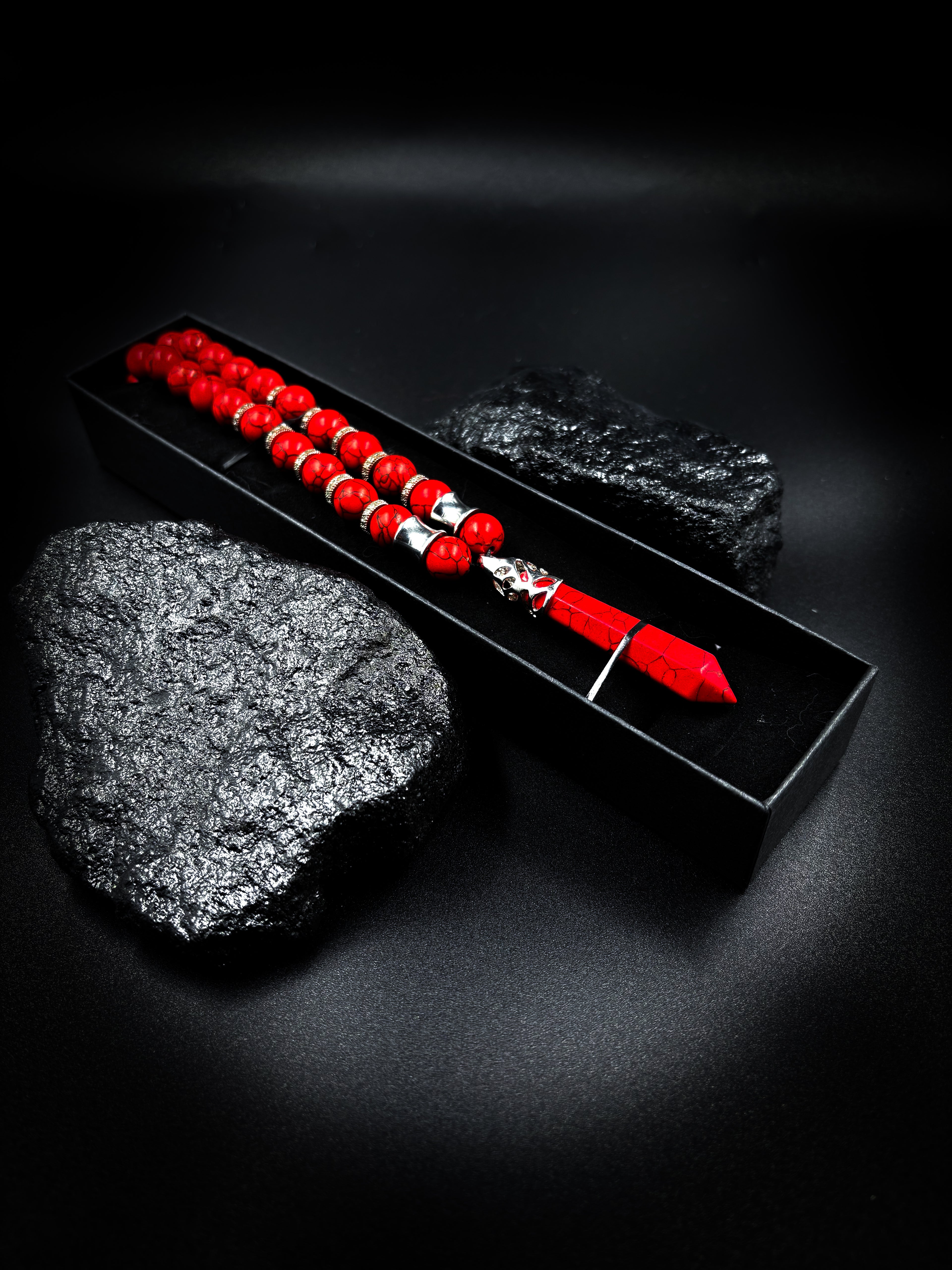 Red pen with black inkstone on a dark background